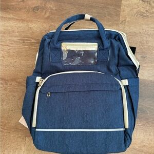 Diaper bag with changing station